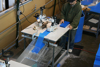 Worker operating a CNC Machine